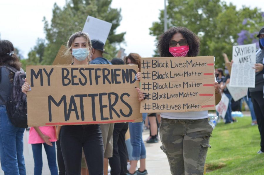 Gabriella Minassian (left) attended Monday’s event with her best friend, Taylor Williams (right). Minassian said Williams has been a “huge part” of her life, and it “breaks my heart that her family is in this much fear.” (Chris Ramirez / Golden Gate Xpress) 