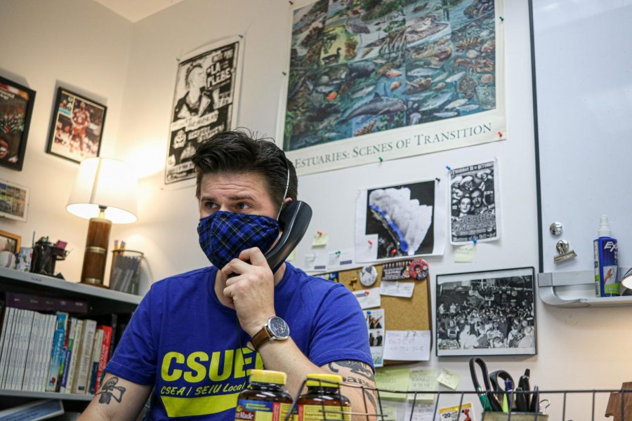 Adam Paganini listens to voice messages he received while he was away. He had not been to the campus since the shelter-in-place order in March. (Harika Maddala / Golden Gate Xpress)
