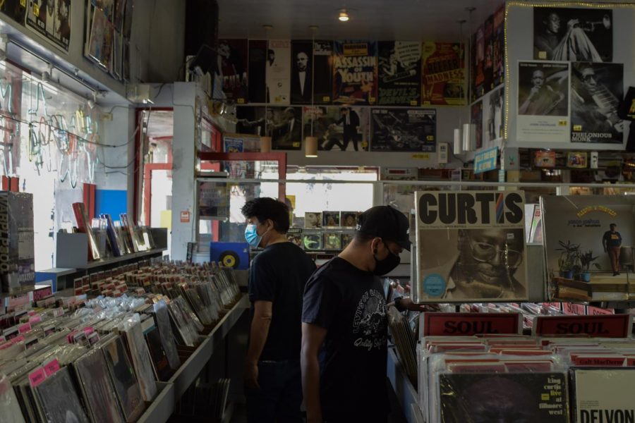 Shoppers browse wide music selections at Amoeba Music, a local record store in Berkeley CA, after they reopen their doors on Oct. 16, since the COVID-10 closures in March. (Leila Figueroa / Golden Gate Xpress)