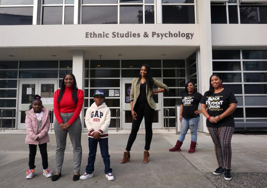 Shanice Robinson, her niece and son, Tiffany Knuckles, Tachelle Herron Lane, and Danielle Tompkins, who organized Soul of SF to channel the voices and experiences of Black students, staff and community members of SF, stand in front of the Ethnic Studies and Psychology building at SF State in San Francisco, on Nov. 21, 2020. (Alex Drew / Golden Gate Xpress)