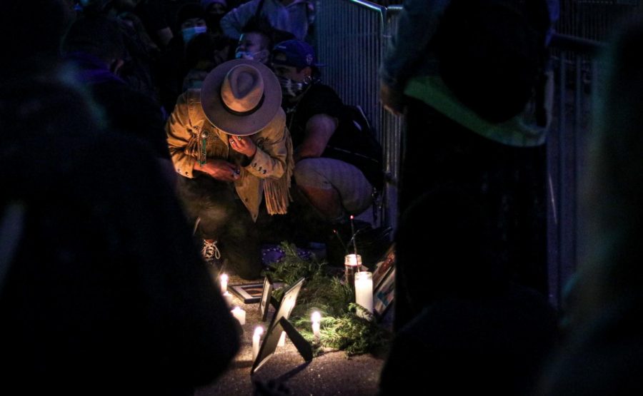 A protester pays respects for the Black people killed recently, at the altar setup outside the City Hall building, during the 4th of July protest, in San Francisco, Calif., July 4, 2020. (Harika Maddala/ Golden Gate Xpress)