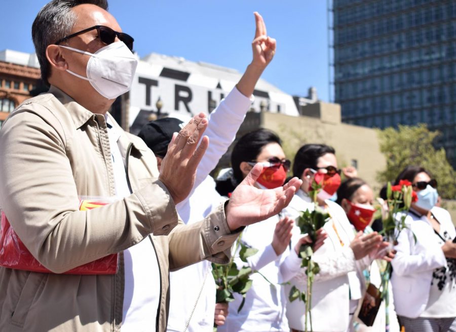 Attendants at the Flower Strike at the United Nations Plaza/Civic Center on Saturday, April 10, 2021. The strike commemorated those who had died in the anti-coup protests. (Lucky Whitburn-Thomas / Golden Gate Xpress)
