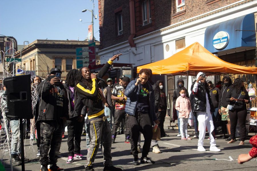 Local rappers Footz (Left) and Marlee Boy (Right) enjoying themselves while performing for audience members at 415 Day Fest on Larkin Street. (Dan DeJesus / Golden Gate Xpress)