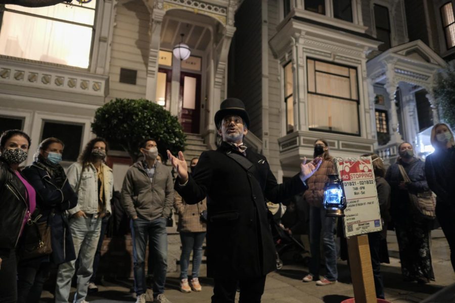 Dressed to mimic the Haunted Mansion archetypes from Disneyland, Christian Cagigal offers attendees of the SF Ghost Tour stories of various spirits that still have a presence, on Oct. 26, 2021. Attendees came from all across the Bay Area and out of state. (Cameron Lee / Golden Gate Xpress)