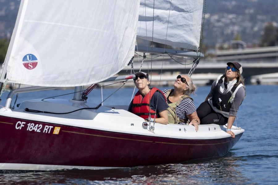 (Right to Left) Rebecca Hinden, Lisa Rohr and Kathy Logan sail a Harbor 20 sailboat named Puff Mommy during a regatta at the Oakland Estuary in Alameda, Calif., on Oct. 10, 2021. Rohr offered up her boat to be used during the 29th Women’s Sailing Seminar. (Nicolas Cholula/Golden Gate Xpress)