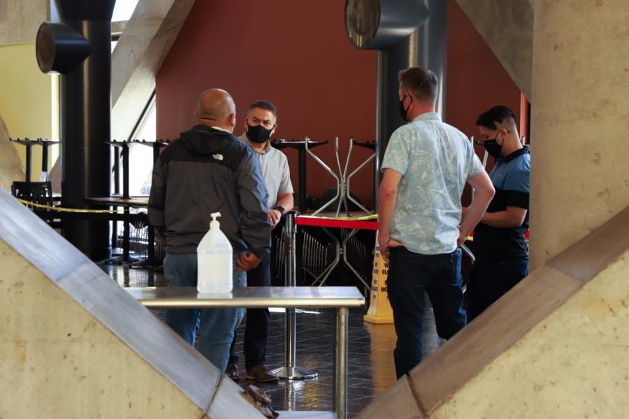 UCorp Staff and owners of vendors discuss indoor seating on the Lower Plaza level on Sept. 29, 2021. Reopening of indoor seating will happen next Monday.(Amaya Edwards / Golden Gate Xpress)