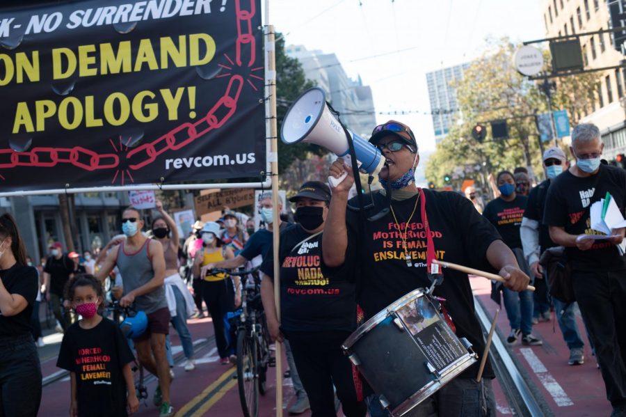 Xochitl leads a chant as the group marches down Market Street for San Francisco’s March for Our Rights on Oct. 2, 2021. Degrading women or revolution they asked, to which crowds responded, I choose revolution! (Morgan Ellis / Golden Gate Xpress)