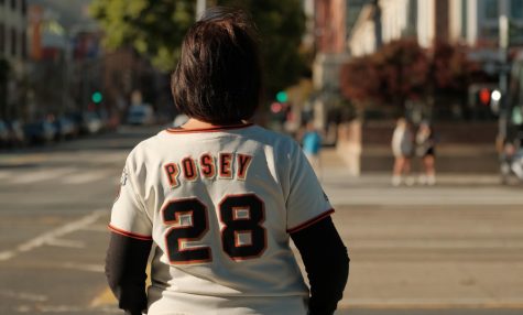 A fan watches Buster Posey enter and leave Oracle Park on Nov. 4, 2021. Poseys retirement came after his resurgence during the 2021 season. (Cameron Lee / Golden Gate Xpress)