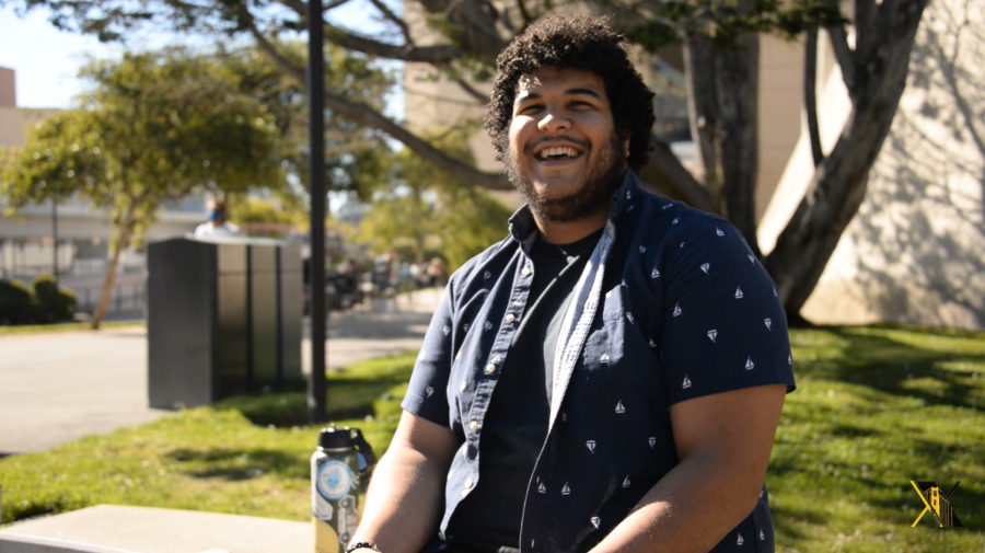 Dan Brown, an SF State senior, sits in front of the Cesar Chavez Student Center on Thursday, Sept. 30, 2021. As a transfer student, Dan switched majors and went from pursuing a degree in music to pursuing a biology degree once attending SF State. (Garrett Isley / Golden Gate Xpress)