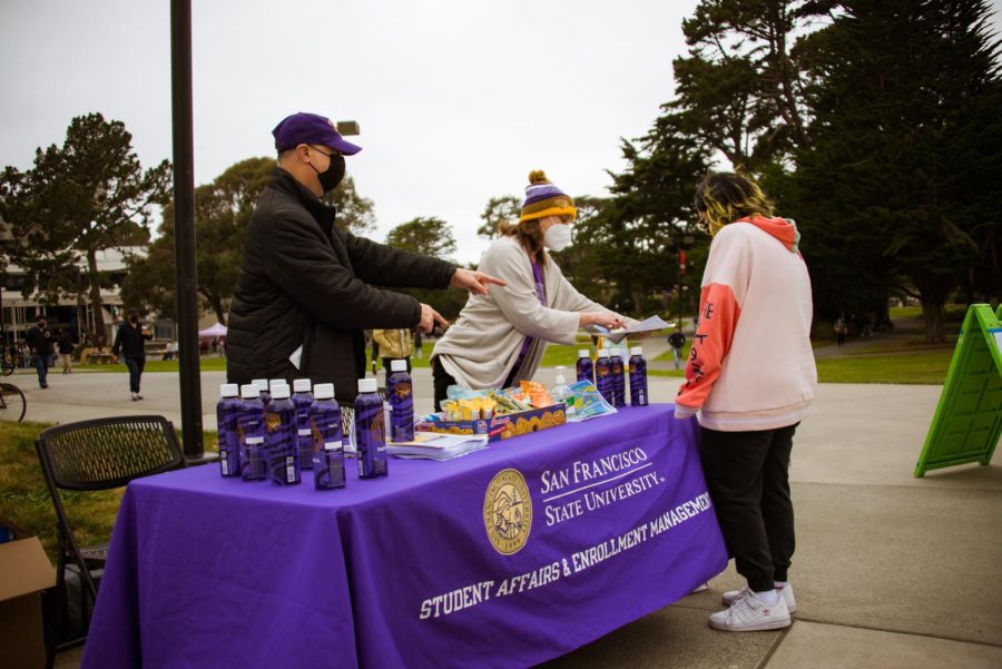 SF State faculty Ash Klein and Rick Harvey station outside J. Paul Leonard library, offering assistance to students for the first day of in-person classes on Feb.14, after nearly two years of virtual meetings. (Garrett Isley / GoldenGateXpress)