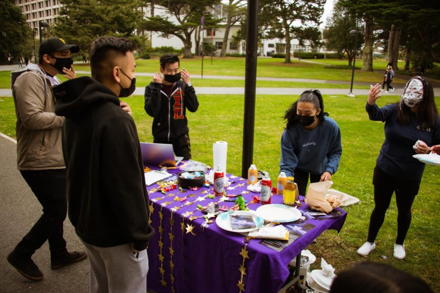 Delta Sigma Pi member Kayla Kim gets pie’d in the face to raise money for Into the Deltaverse in the Quad for the first day of in-person classes on Feb.14 (Garrett Isley / Golden Gate Xpress)