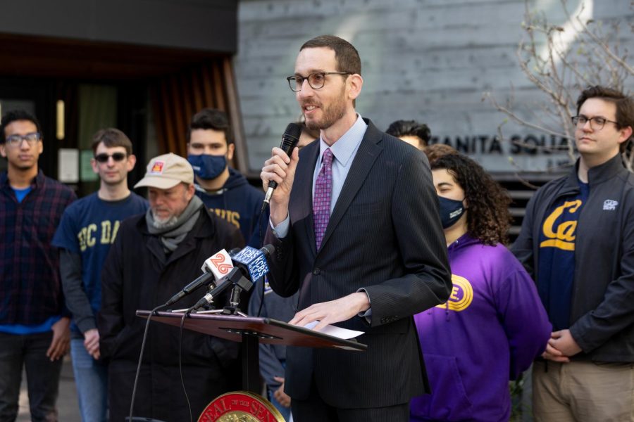 Sen. Scott Wiener (D-San Francisco) announces a new housing reform bill, SB-886, at Manzanita Plaza at SF State, with many students of different campuses behind him on Feb. 22. The bill would streamline the construction of affordable housing for colleges in California.  (Abraham Fuentes / Golden Gate Xpress)