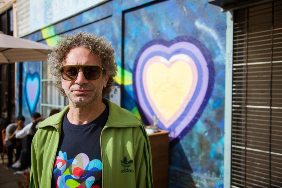 Duser at his Paint the Void mural in the Lower Haight on Feb. 5. (Garrett Isley / Golden Gate Xpress)