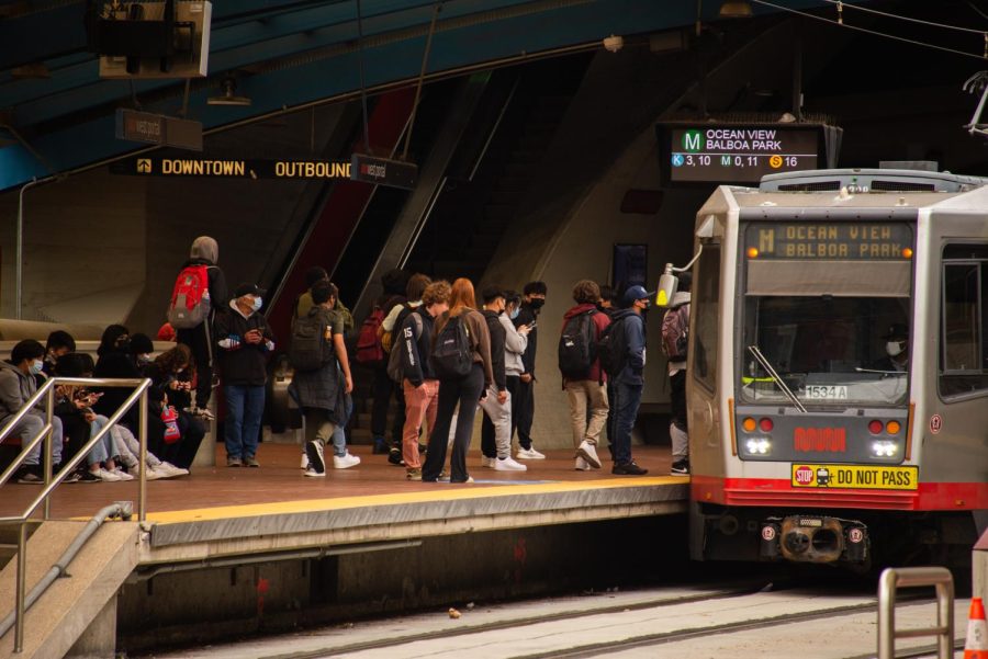 Students board the outbound M-train at West Portal station in San Francisco on Monday, April 4, 2022. (Garrett Isley / Golden Gate Xpress)