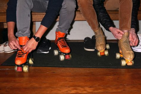 Skaters tie their skates up at Church of 8 Wheels in San Francisco on Dec. 3, 2021. (Maximo Vazquez / Golden Gate Xpress)