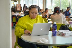 Skylar Swearington, a SF State senior and communications major, works on homework in the library on SF State’s campus in San Francisco, Calif., on Sept. 28, 2022. The library is Swearington’s go-to study spot. (Tatyana Ekmekjian / Golden Gate Xpress)