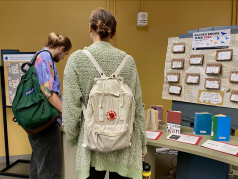 SF State students Joshua Jensen and Starlit Brown browse the banned books display in the J.Paul Leonard library on Sept. 23, 2022. (Jensen Giesick / Golden Gate Xpress)