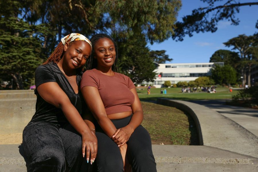 Simone Brown (left) and Adokor Swaniker (right) pose for a portrait at Malcolm X Plaza on Wednesday, Sept. 21, 2022. Both Brown and Swaniker are members of the SF State chapter of the Black Menaces, an organization of Black college students that use TikTok to start discussions about race and other various social issues on college campuses. (Juliana Yamada / Golden Gate Xpress)