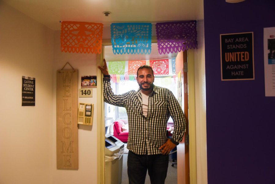 Emmanuel Padilla poses in front of the new Latinx Student Center on campus on Aug. 24, 2022. Padilla is the inaugural director for the center. (Rene Ramirez / Golden Gate Xpress)