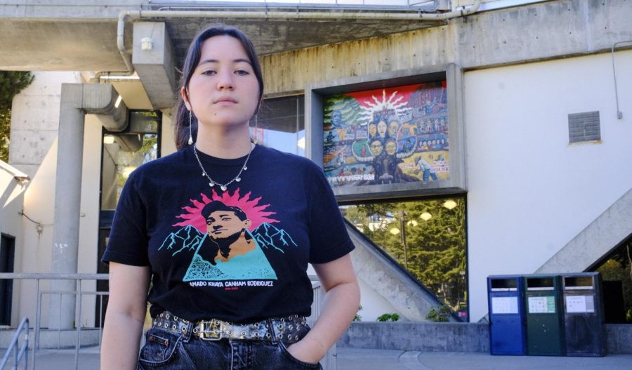 Megan Murphy, the Interim Chair for the League of Filipino Students, poses for a portrait in front of a mural containing prominent figures in Filipino American history at the Cesar Chavez Student Center at SF State on Oct. 24, 2022. (Miguel Francesco Carrion / Golden Gate Xpress) 
