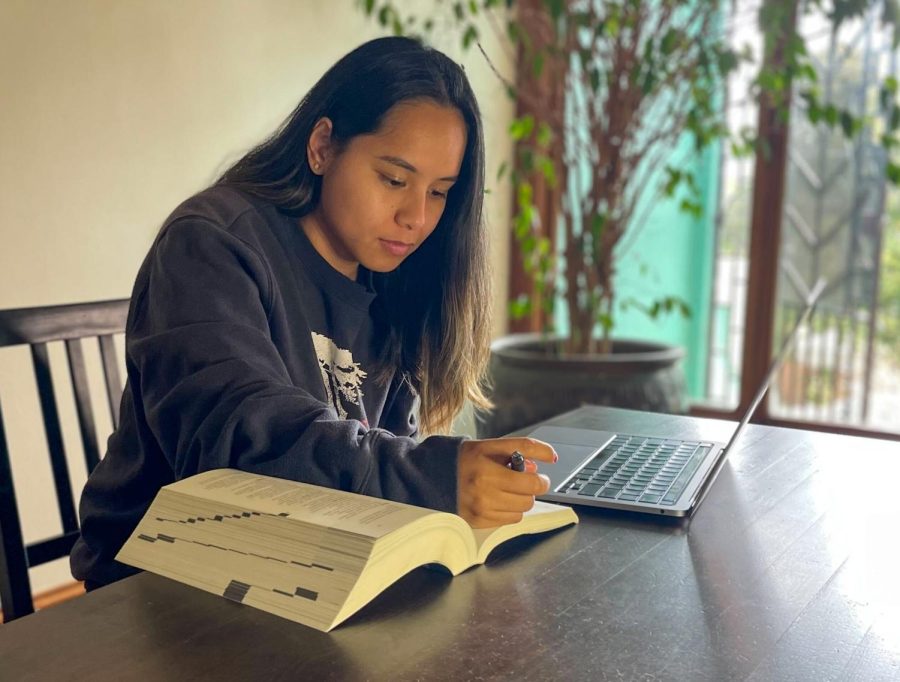 SF State graduate Pam Gutierrez works in her home on Sept. 28, 2022. She hopes to return to school once her debt is forgiven. (David Blakeley / Golden Gate Xpress)