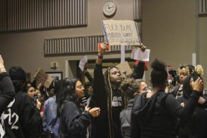 Protesters gather in Jack Adams Hall at Project Rebound’s District Attorney Q&A on Oct. 20, 2022. (Neal Wong for Golden Gate Xpress)
