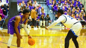 Toby Okwuokei (left) dribbles the ball during the SF State vs CSU San Bernardino basketball game in the Main Gym at Don Nasser Plaza on Dec. 1, 2022. (Miguel Francesco Carrion / Golden Gate Xpress) 