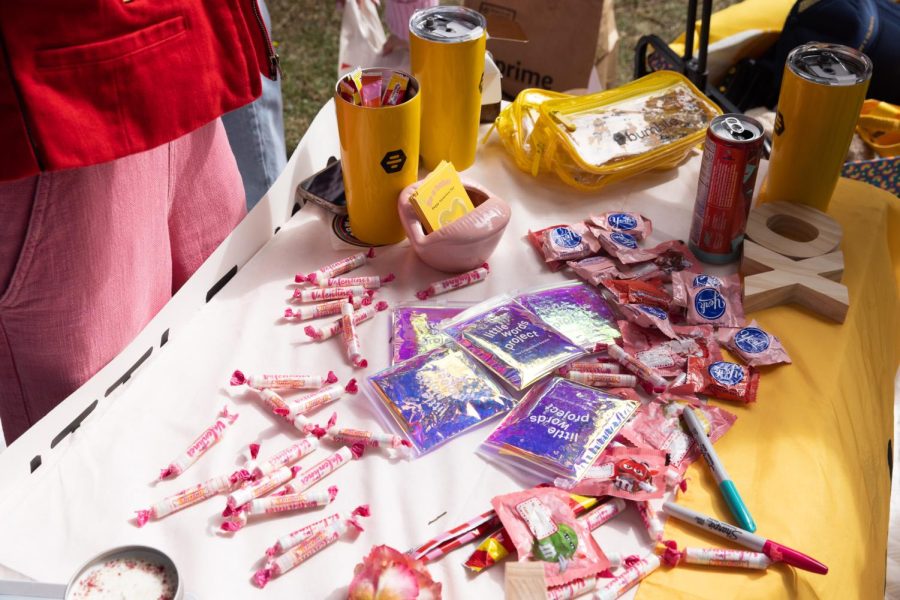 Bumble promotional merchandise rests on a table at SF State’s Quad on Valentines Day on Tuesday, Feb. 14, 2023. The matchmaking app Bumble was promoting their services on campus during Valentines Day. (Benjamin Fanjoy / Golden Gate Xpress)