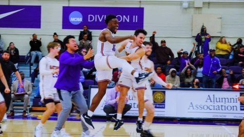 Players from the SF State mens basketball team celebrate their win against Cal State East Bay after going into overtime in the Main Gym at Don Nasser Plaza on Saturday, Feb. 25, 2023. (Miguel Francesco Carrion / Golden Gate Xpress)