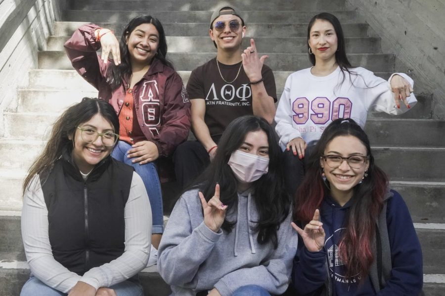 Members of various Latinx student organizations gather together for a group photo on the steps near the Cesar Chavez Student Center at SF State on Monday, Feb. 13, 2023. (David Jones / Golden Gate Xpress)