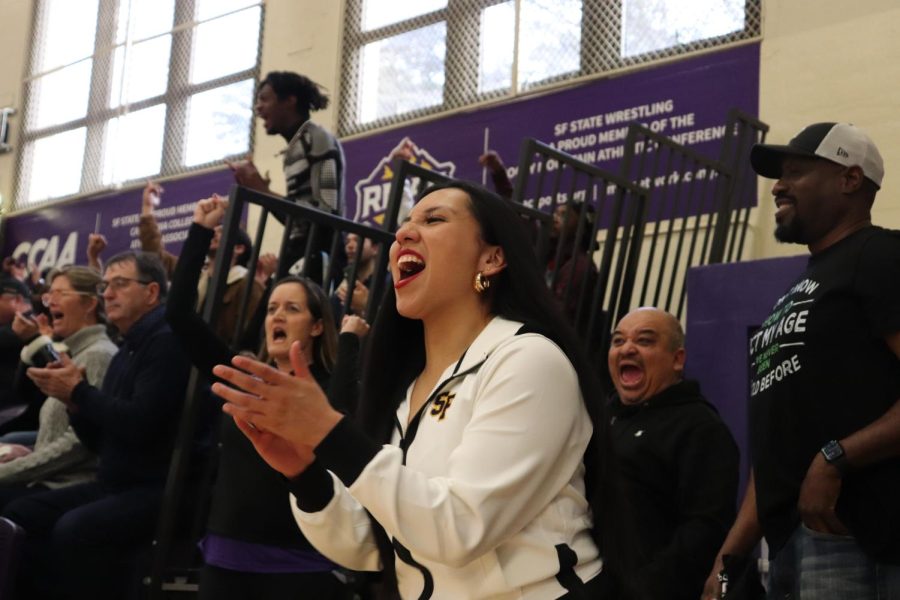 Stephanie Perez cheers on SF State against Cal State East Bay as the score ties 64-64 on Saturday, Feb. 25, 2023.  (Daniela Perez / Golden Gate Xpress) 