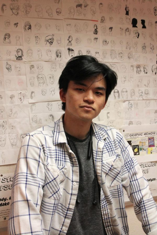 Hugh Wang, a member of SF State’s Comic Arts Club, poses for a portrait outside their meeting room on March. 2, 2023.  (Leilani Xicotencatl/ Golden Gate Xpress) 
