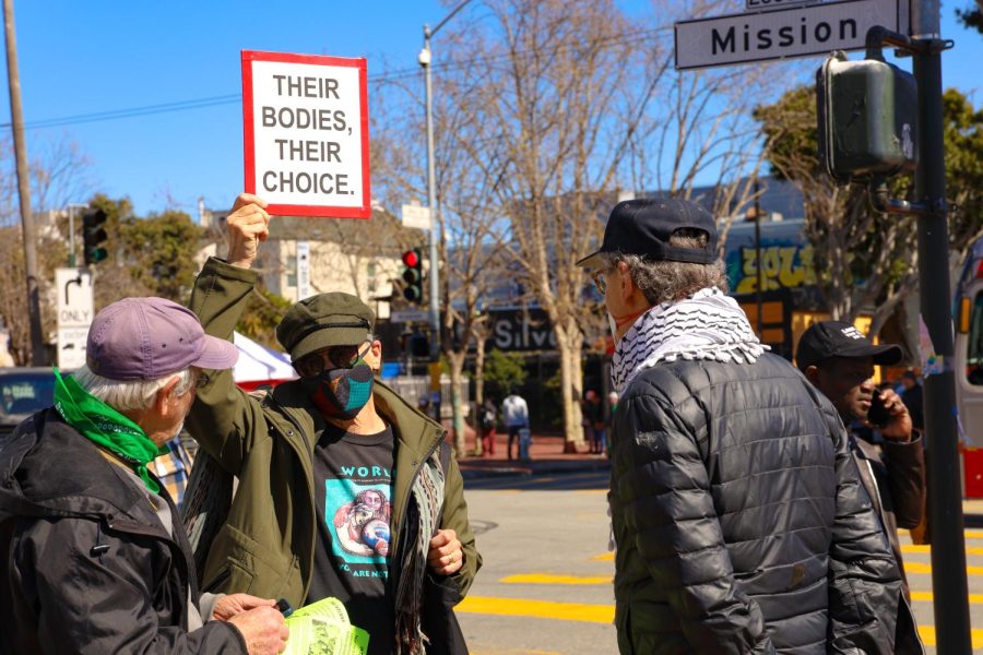 Martha Hubert holds up a sign in San Francisco, Calif., on March 8, 2023. When asked why she attended the International Women’s Day rally, Hubert said “I am here in defense of the lives of women. I’m so angry. It seems like it’s getting worse.” (Gina Castro / Golden Gate Xpress)