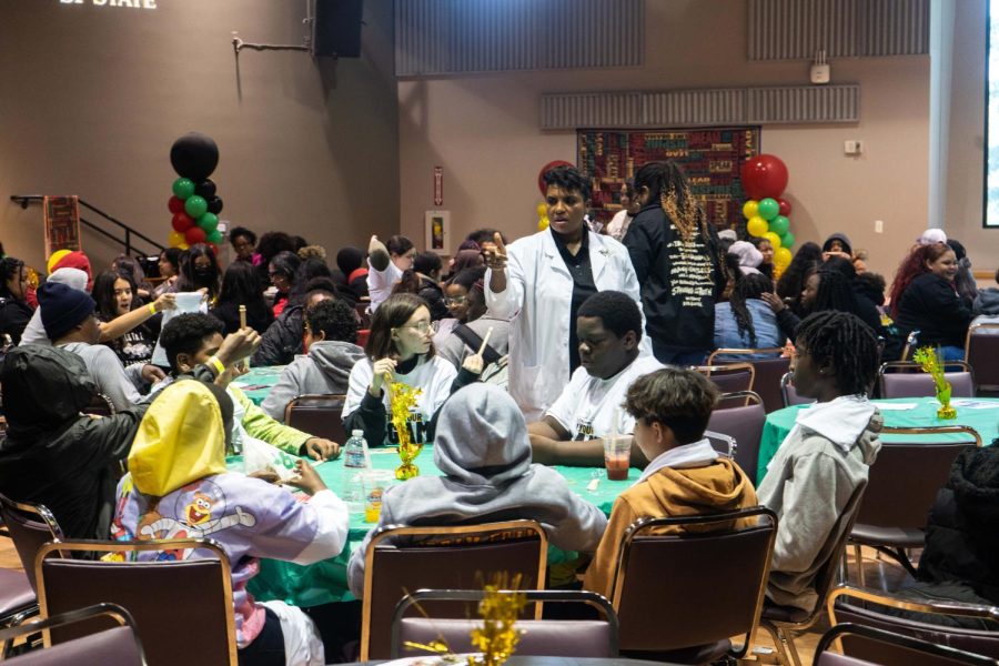 Valerie Bennett, international speaker and STEM coach, browses the crowd to see the students progress at the first annual Black History Month Conference at the Jack Adams Hall of SF State on Tuesday, Feb. 28, 2023. (David Jones / Golden Gate Xpress)