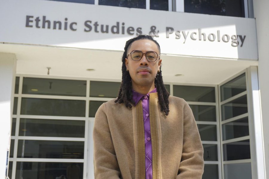 Assistant Professor of Queer and Trans Ethnic Studies Dr. Alan Pelaez Lopez poses for a portrait in front of the College of Ethnic Studies and Psychology at SF State on April 5, 2023. (Tatyana Ekmekjian / Golden Gate Xpress)