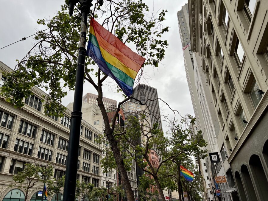 In celebration of this weekend’s Pride festivities, pride flags decorate the outside of the Four Seasons Hotel on Market St. on June 23, 2023. (Zac Zavala / Golden Gate Xpress)