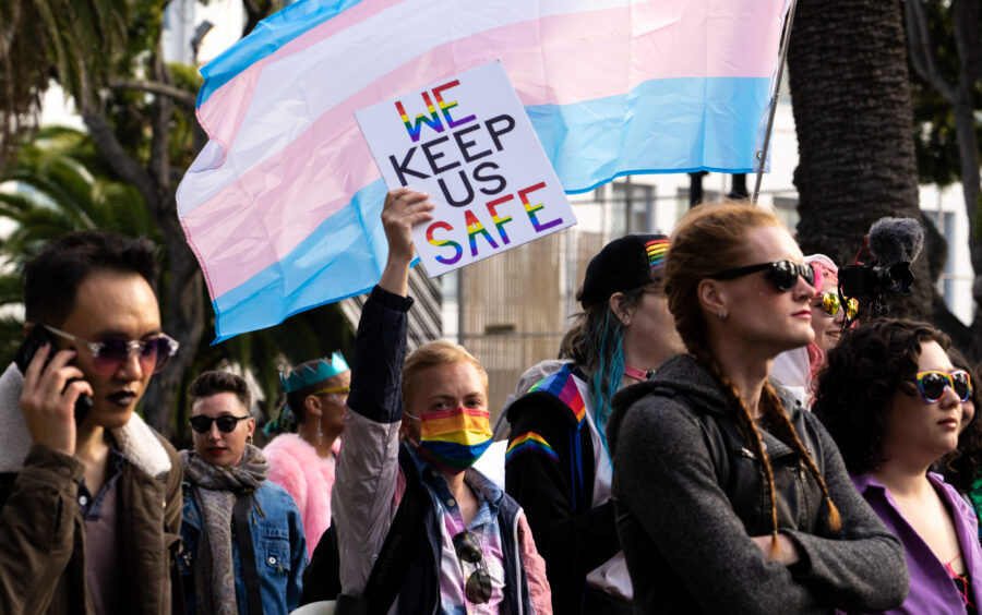 A march supporter raises their sign, “ We Keep Us Safe,” during the SF Trans March on June 23, 2023. (Michaela Mateo / Golden Gate Xpress)