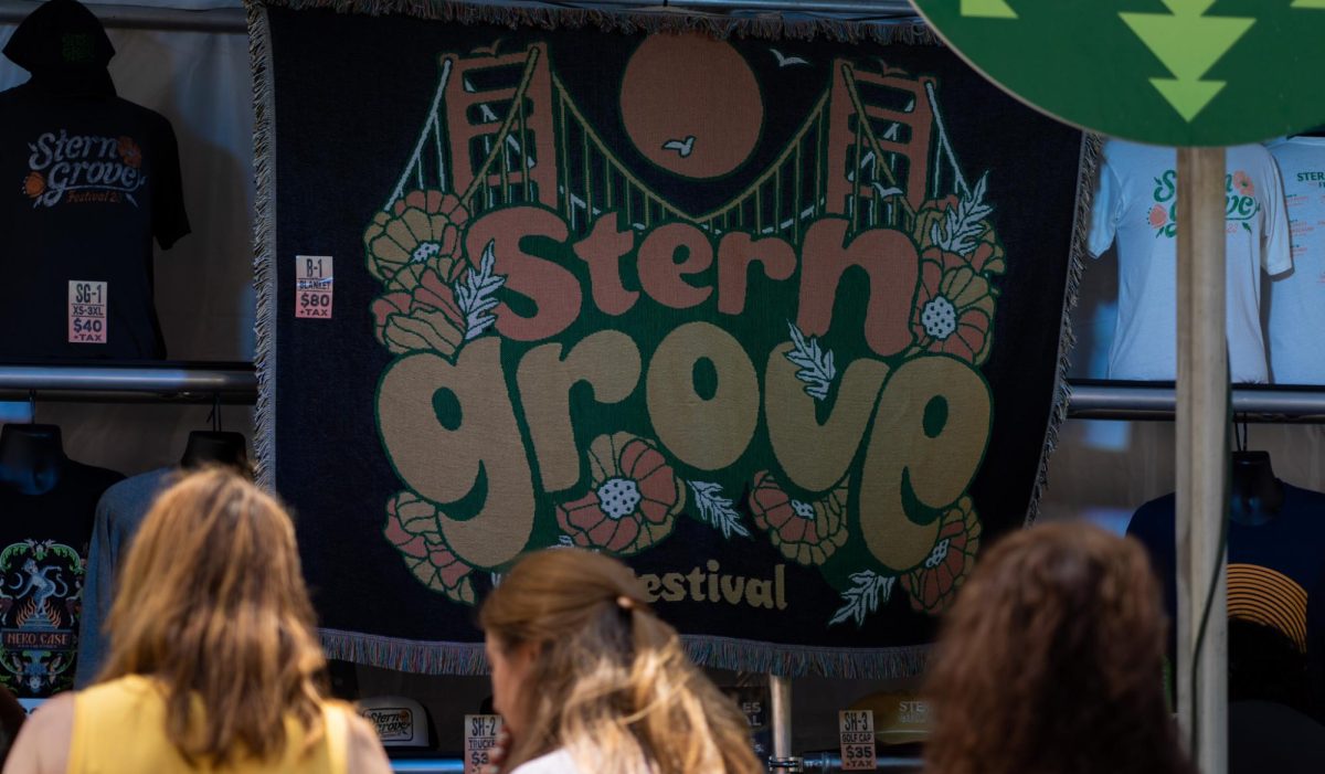 The Stern Grove Festival merch stand attracts festival goers to shop and commemorate the concert event on June 25, 2023. (Michaela Mateo / Golden Gate Xpress) 