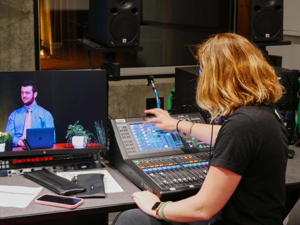 Feature Photo Caption: Hannah Zolezzi, BOSA primary audio engineer, is live sound mixing an episode of “Office Hours” on May 19, 2023 in Marcus Hall, Studio 2, at SF State. (Photo Courtesy: Vincent-Andrew Lee) 