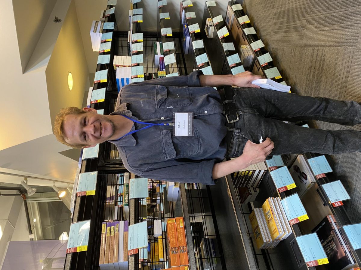 Bookstore worker Anthony Buchanan is on his 2nd day working at the SFSU Bookstore on August 21, 2023. (Colin Flynn / Golden Gate Xpress)