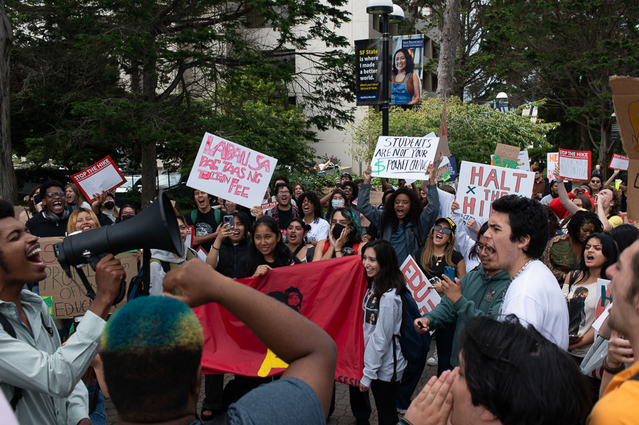 Students hold signs in opposition of proposed tuition increase and take turns speaking into the megaphone at SF State, Monday, Sep. 11, 2023. (Matthew Ali / Golden Gate Xpress)