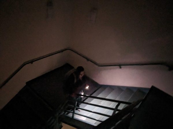 A student walks through a pitch-black Humanities Building staircase while using her phone as a flashlight on Sept. 19. (Daniel Hernandez / Golden Gate Xpress)