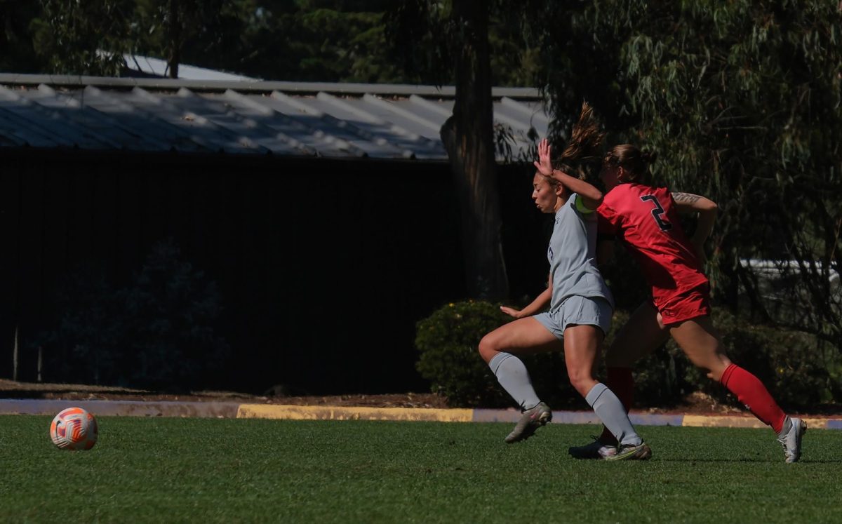 (L-R) Carissa Capinpin, SFSU senior, and Payton Heaney, a CSUEB junior, battle for the ball during the SFSU vs. CSUEB women’s soccer match in Cox Stadium on Thursday, Oct. 12, 2023. (Andrew Fogel Golden Gate Xpress)
