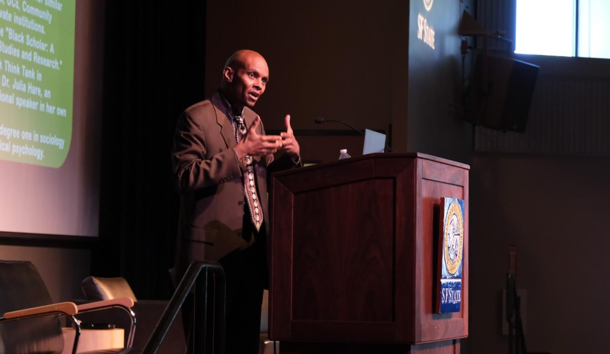 Abul Pitre, the chair of the Africana Studies department, speaks during the Origins of Black Studies: The SFSU Black Student Unions Legacy with Dr. Jimmy Garrett event in Jack Adams Hall on Wednesday, Oct. 11, 2023. (Andrew Fogel/Golden Gate Xpress) 
