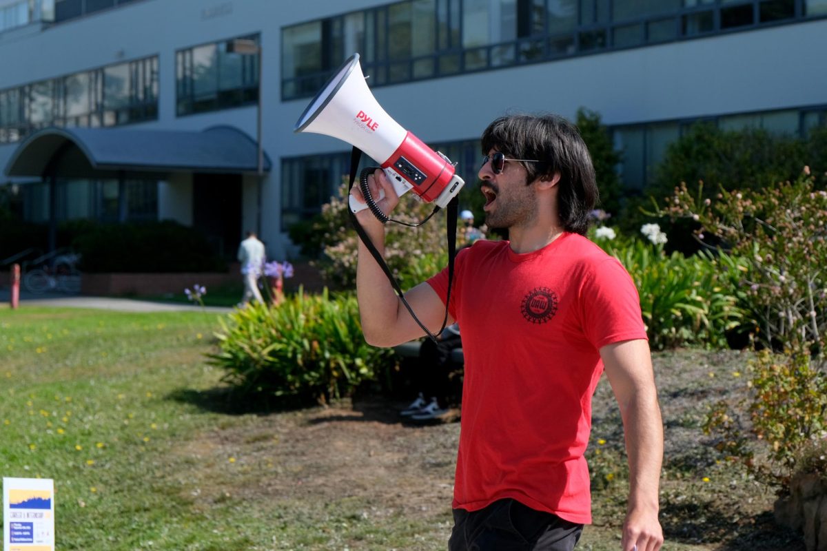 Sean Sliger leads the student workers rally back to Malcolm X Plaza after protesting in front of the administration building on Sept. 21, 2023. (Andrew Fogel/Golden Gate Xpress)
