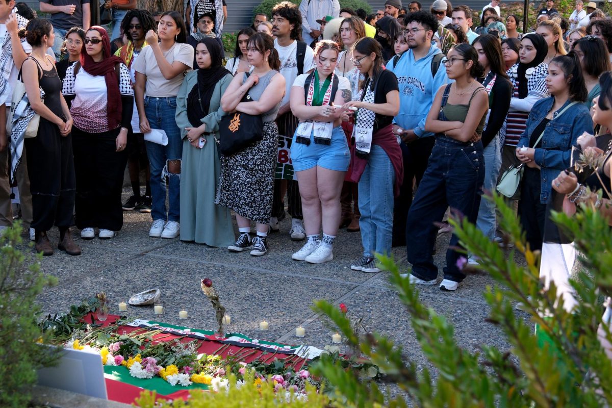 A group of people gather outside of the Ethnic Studies building for the Vigil for Gaza on Thursday, Oct. 19, 2023. (Andrew Fogel/ Golden Gate Xpress)