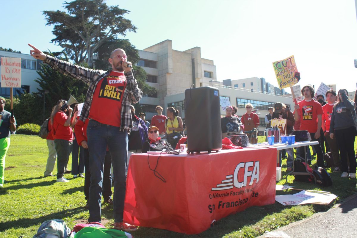 Mark Allen Davis, associate professor in the African Studies department and racial and social justice representative for the California Faculty Association, speaks to protesters on a CFA walk-out on Thursday, Oct. 26, 2023. (Kayla Williams / Contributor Golden Gate Xpress)