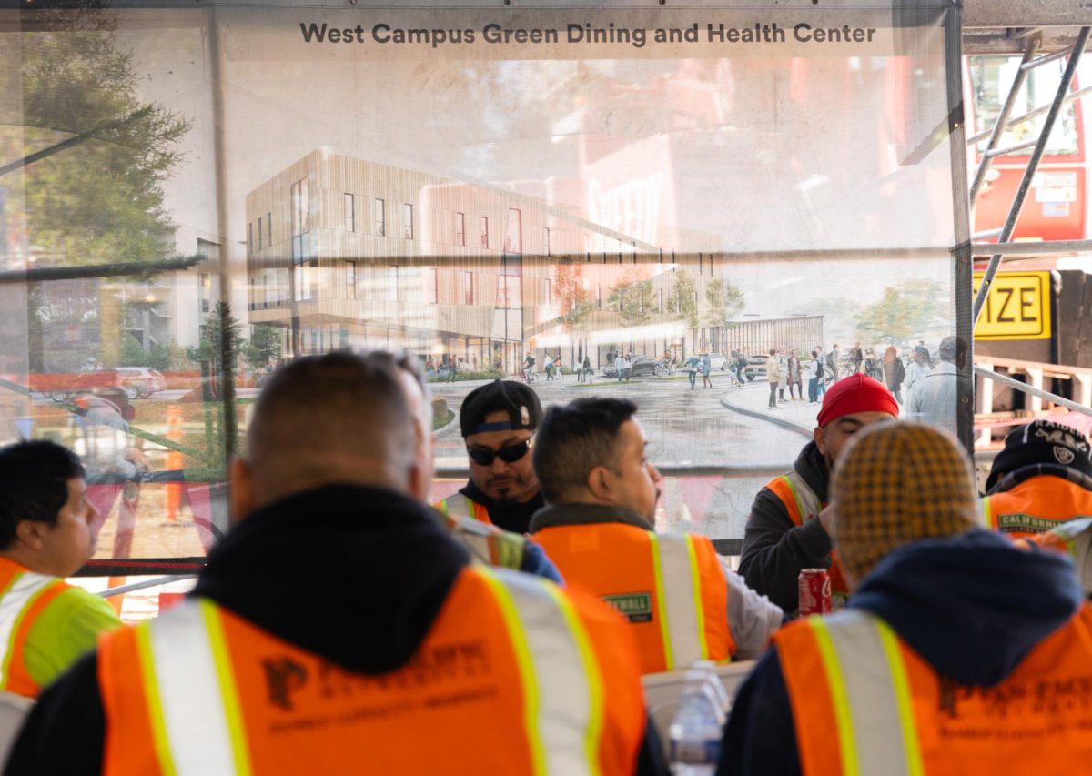 Site workers enjoy food and recreation in the ‘topping off’ (last beam installment) celebration of the upcoming West Campus Green Dining and Health Center on Nov. 1, 2023. (Michaela Mateo / Golden Gate Xpress) 