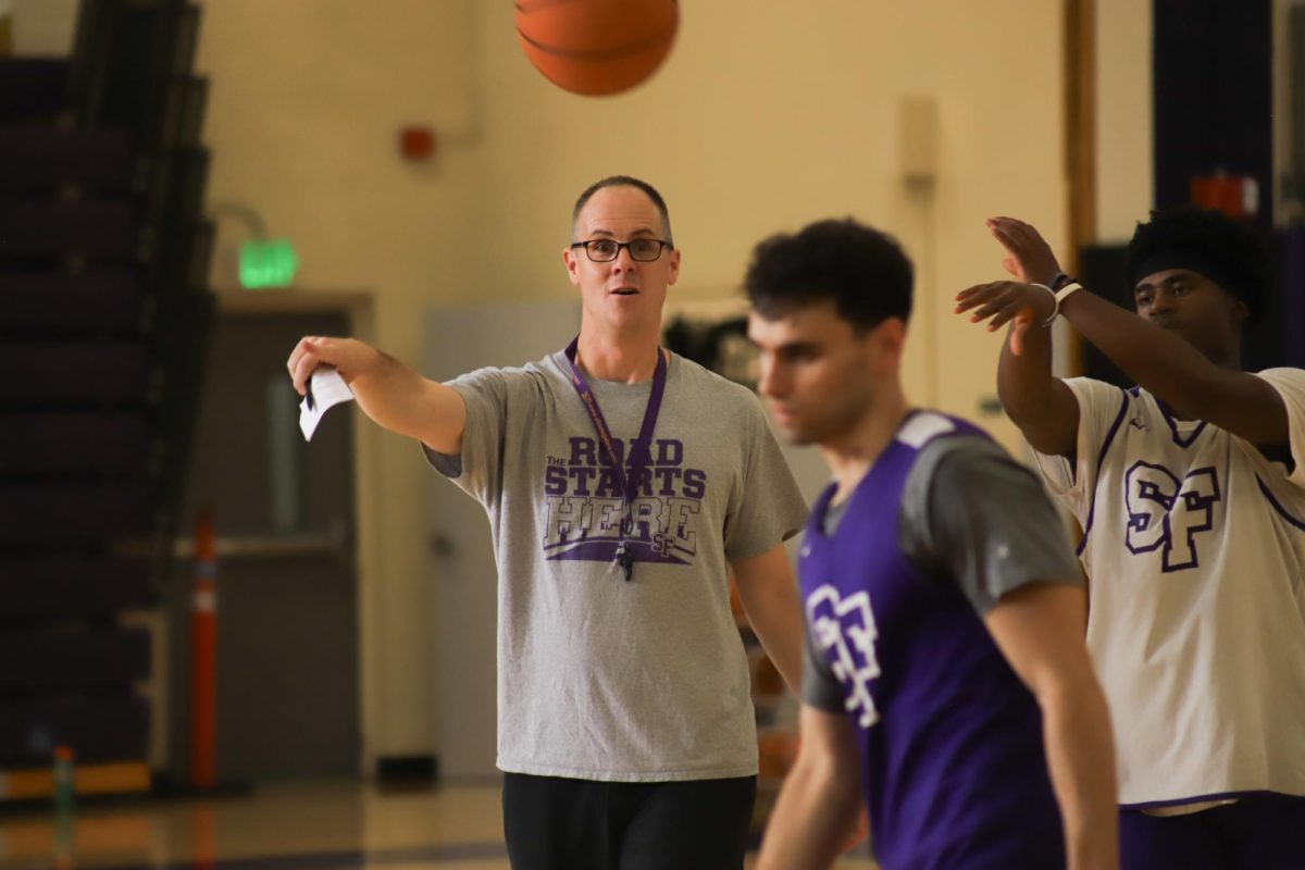 Coach Vince Inglima explains how to execute a drill during practice at the SFSU Gymnasium in San Francisco on Oct. 20, 2023. (Colin Flynn/ Golden 
Gate Xpress)
