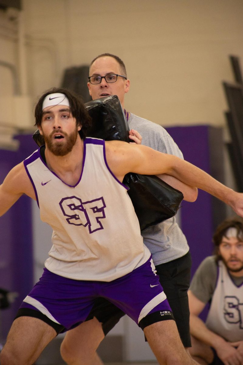 Coach Vince Inglima guarding Jonah Roth during a drill at the SFSU Gymnasium in San Francisco on Oct. 20, 2023. (Colin Flynn/ Golden Gate 
Xpress)
